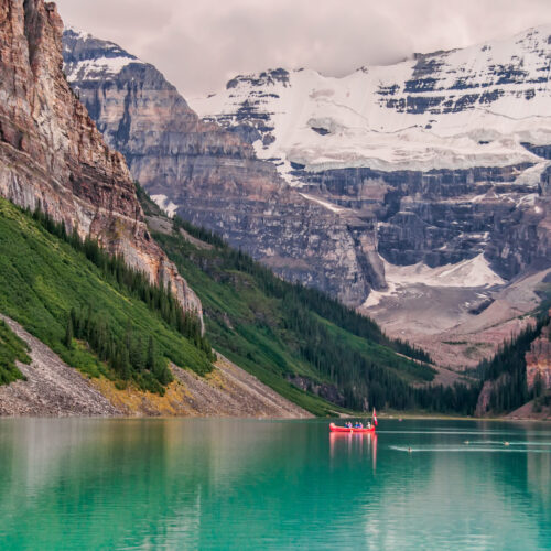 Red Boat In The Lake Near Mountain
